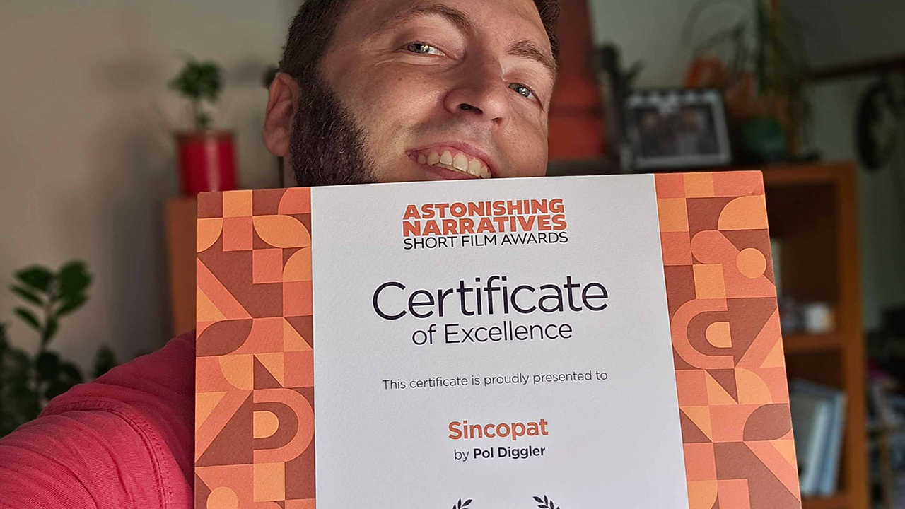 nominee holding up certificate