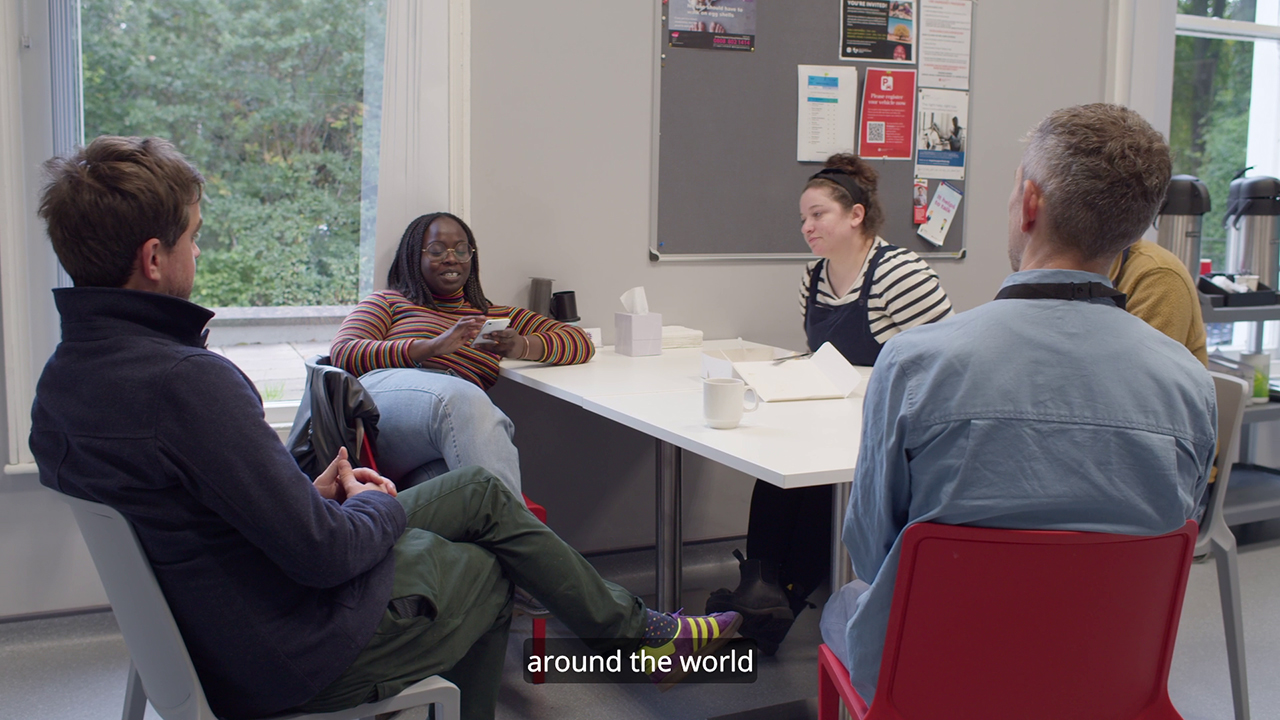 screenshot of video of students in canteen